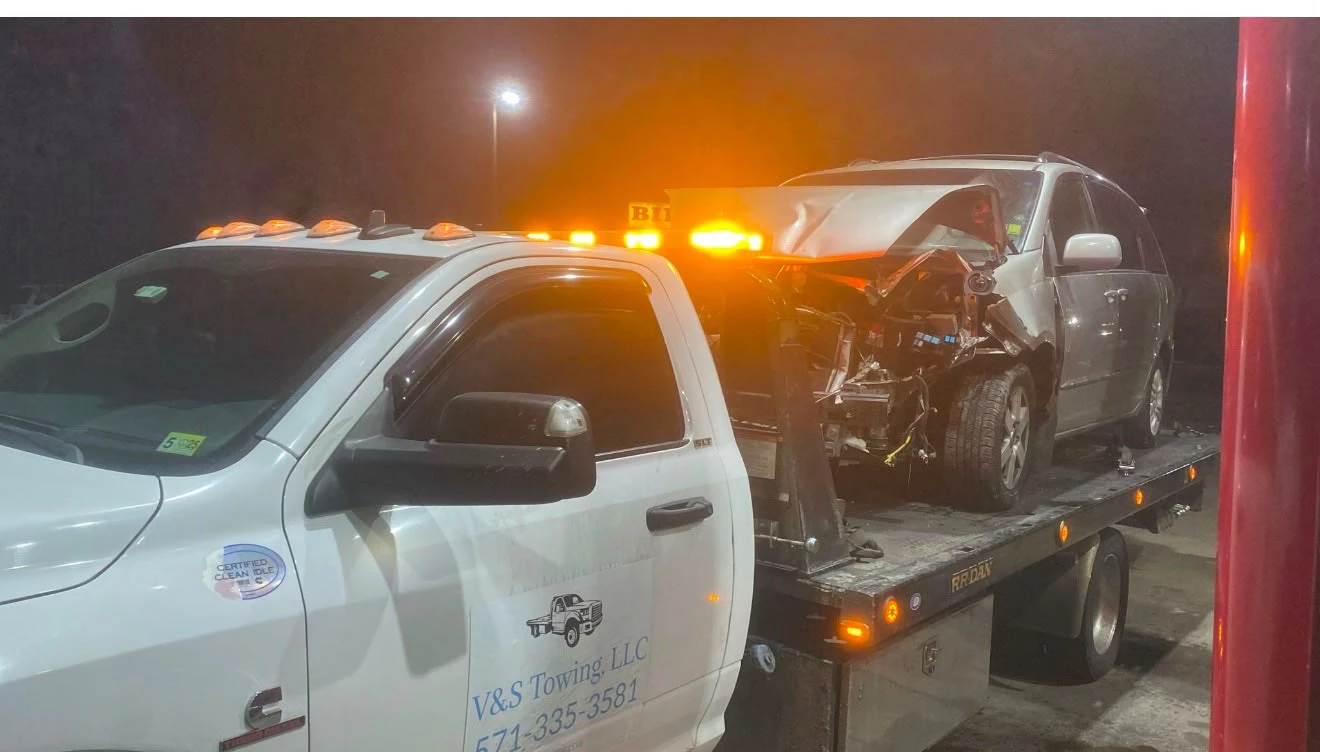 V&S Tow Truck loading a wrecked vehicle after an accident in Fairfax VA